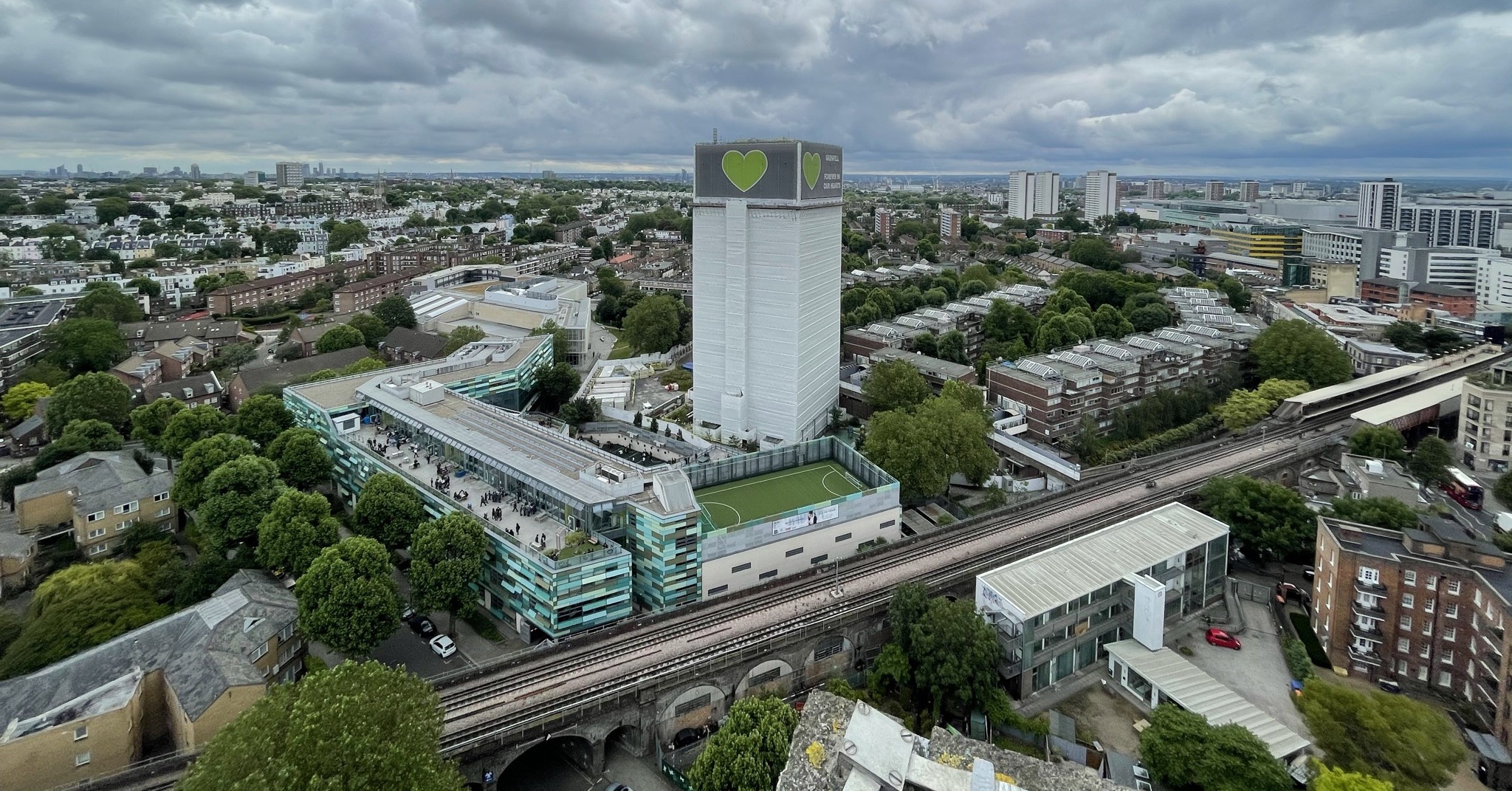 An aerial shot of Grenfell Tower and the surrounding area at dusk